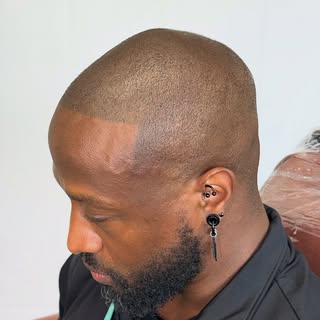 This client came in looking to add density while keeping a clean, barber style hairline. We customiz