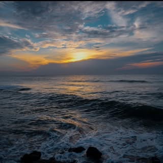 "Welcoming the dawn with tranquil waves and a peaceful heart. 🌅 #BeachSunrise #SereneMoments#mahaba