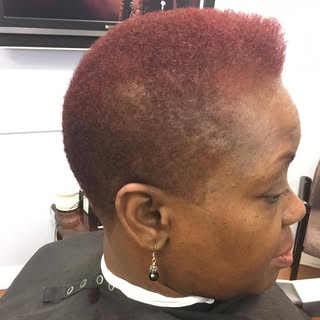 Hair is the ultimate accessory. A women’s short haircut and color with layers, texture, or bold tone