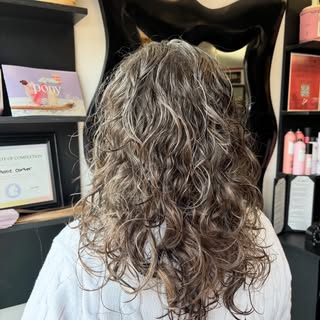 A good chop and some layers to let her curls thrive!!
