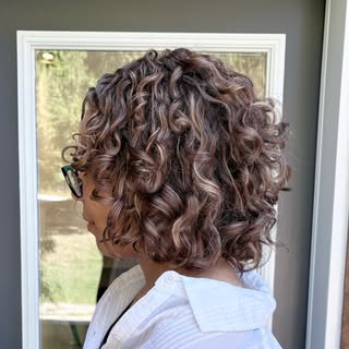 A global gloss in a rich tone and a Curl Potential cut transformed this clients hair!