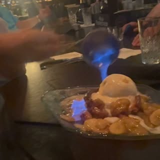 Dinner at Hyde Steakhouse featuring their famous flaming butter bread, finished with bananas and ice
