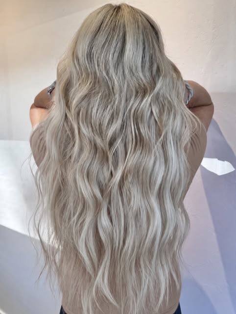 Helping her achieve her icy blonde hair with 22” extensions. Flip to see the before we almost missed