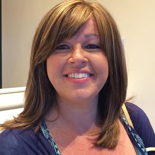 Mindy is loving her new 10" long vacuum hairpiece! Bold highlights and a swing bang compliment her p