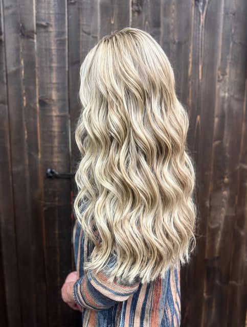 Beautiful dimensional blonde waves with soft texture, natural movement, and a polished finish. This 