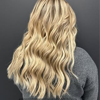 Swipe to see the before! ✨

We added custom-blended extensions to take her hair to long, dimensional