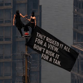 A couple climbed 1,454 feet in the middle of a heatwave this week — no harness, no plan B, just pure
